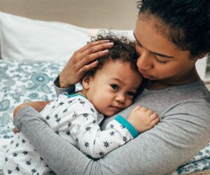 motherhood and mental health - mother comforting her child