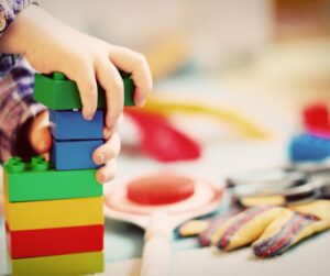 early childhood mental health - child playing with blocks during therapy session