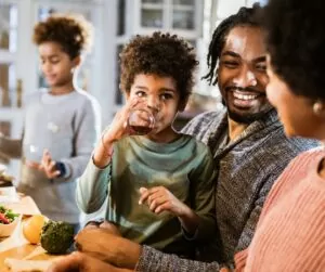 BIPOC Mental Health Month - Black family at dinner table